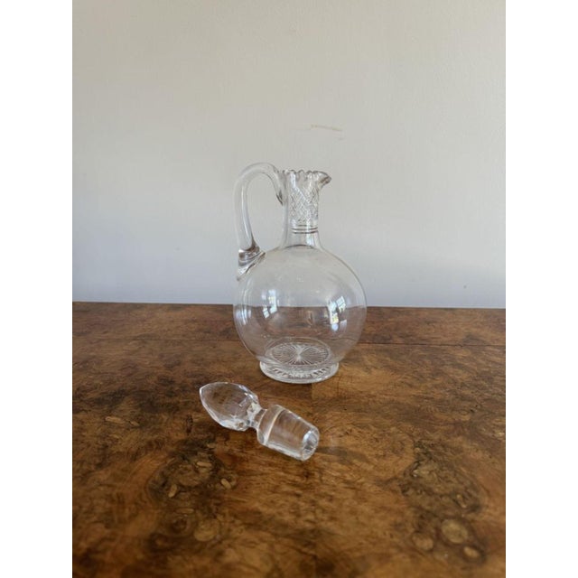 Quality antique Edwardian glass ewer, having a quality glass were with cut glass detail and the original cut glass...