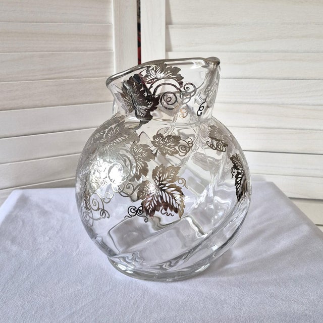 Stunning vintage Cambridge silver overlay art glass pitcher in excellent condition. Featuring a beautifully rounded...