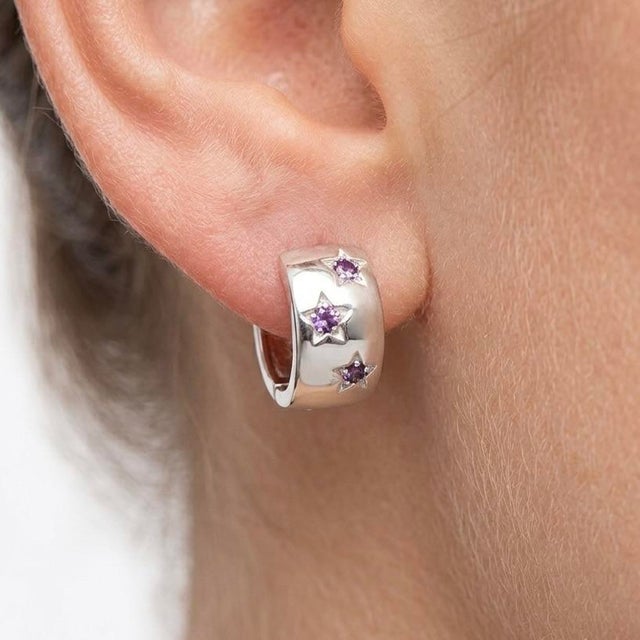 These elegant hoop earrings feature delicate Amethyst gemstones, beautifully set in a sleek and modern design. Known for...