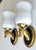 Pair of dimunitive mid-20th-century French Neoclassical wall sconces designed by the esteemed Parisian luxury house,...