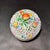A finely executed hand-painted porcelain covered box by Herend, featuring intricate pierced latticework and richly...