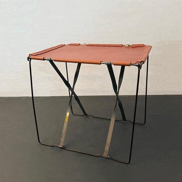 This handsome, bespoke industrial side table is comprised of a 1940's vintage steel wire campaign frame with a sturdy...