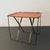 This handsome, bespoke industrial side table is comprised of a 1940's vintage steel wire campaign frame with a sturdy...