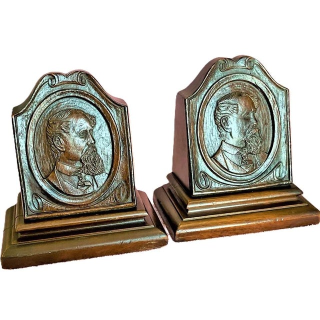 High quality antique hand carved weighted bookends with amazing detail. Mahogany I think. Charles Dickens I think. They...