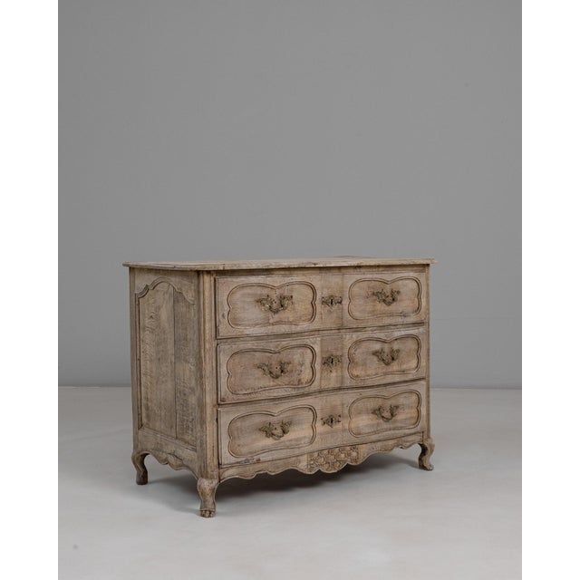 1830s French Louis XV Oak Chest of Drawers. This elegant chest exemplifies the refined curves and soft ornamentation...