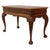 This antique Chippendale style table, dating to approximately 1900, is crafted from mahogany and features intricate floral...