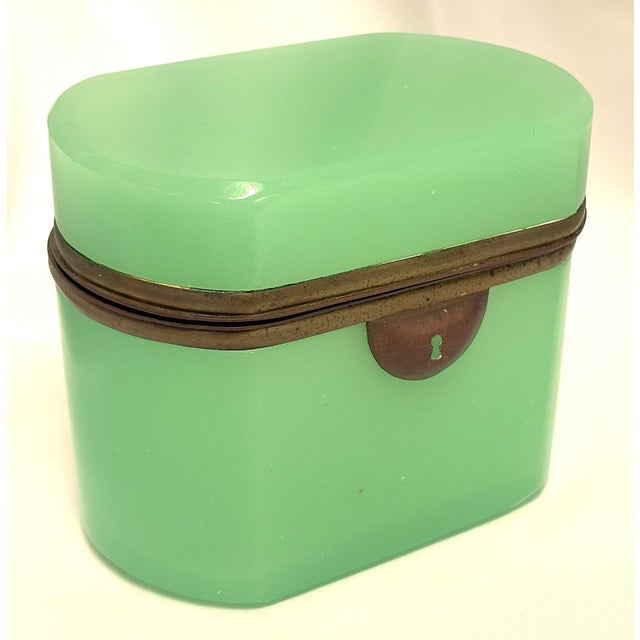 Stunning green opaline glass hinged jewelry box from the late 19th century France. The green opaline glass has a smooth...