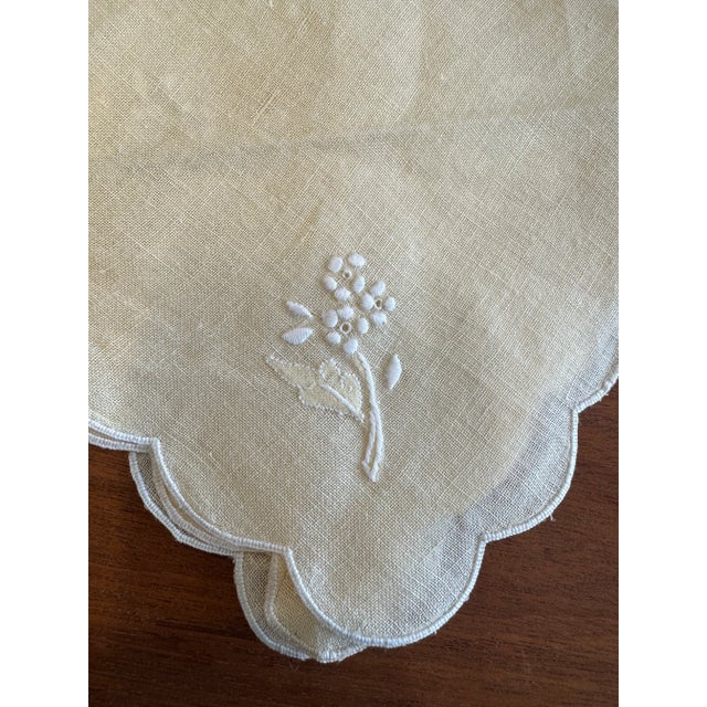Set of nine vintage Italian 1970s embroidered, pale yellow and white linen scalloped edge cocktail napkins.