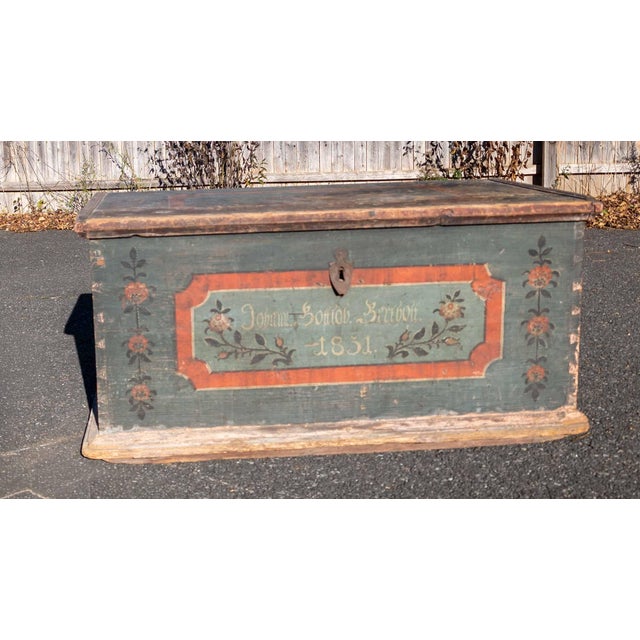 We are selling this great 19th century paint decorated Immigrant chest. This chest has beautiful aged color with floral...