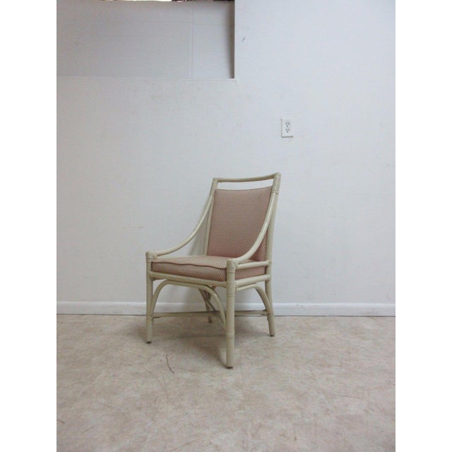 A vintage Mid-Century rattan armchair. Seat height 18" Arm height 22". Great shape, sturdy and tight... shows some wear...