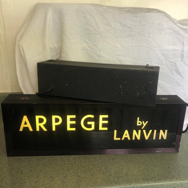 Fabulous and rare set of 2 Vintage Department Store Advertising Perfume signs. They have style and add glamour to wherever...