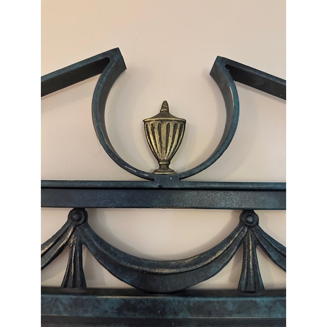 This is a vintage wrought iron wall mirror. There is a coordinating console, coffee and side table available in a separate...