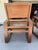 Pair of vintage Art Deco / colonial-style lounge chairs with striking architectural lines and handwoven cane seats. These...