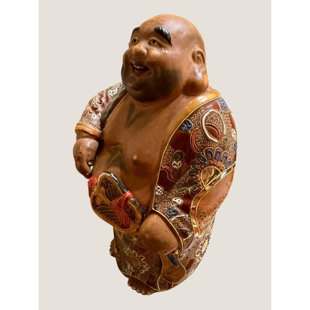 Impressive vintage Japanese Hotei, or Laughing Buddha, ceramic figure featuring elaborate Kutani-style decoration with...