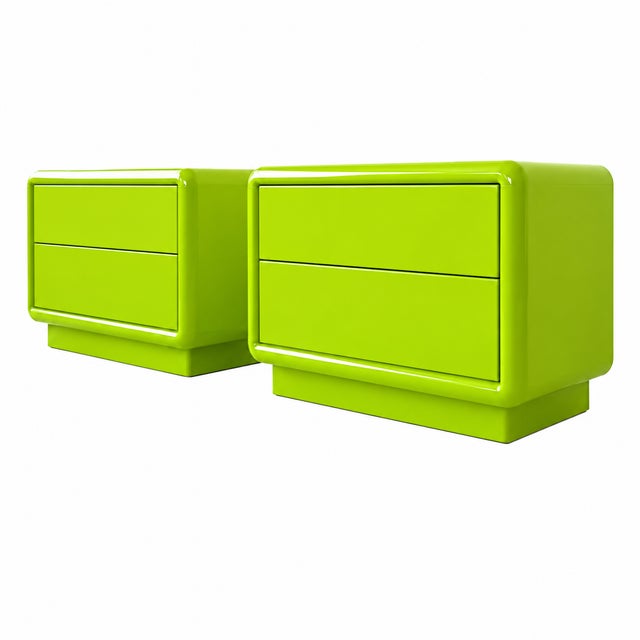 A striking pair of 1980s postmodern nightstands featuring softly rounded corners, bold sculptural frames, and a vibrant...