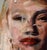 This oil on panel artwork features a close-up portrayal of a face, characterized by expressive brushwork that captures...