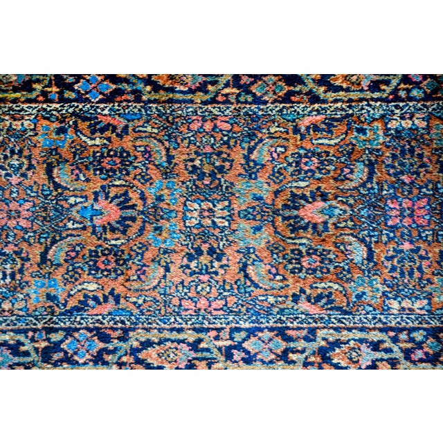 An unusual 19th century Persian Heriz runner, of exceptional length, with a wonderful light and dark indigo floral pattern...