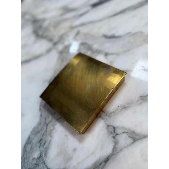 This rectangular mid-century modern box is crafted entirely from solid brass, featuring a brushed satin finish that gives...