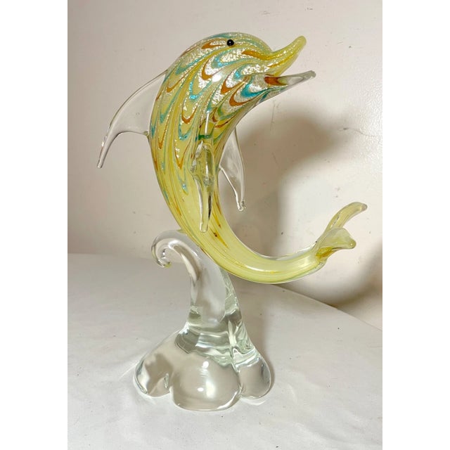 Up for sale is a large vintage hand blown Italian Murano glass dolphin sculpture. It's blown with exquisite detailing...