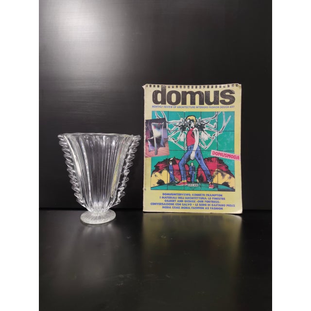 Made in Italy, 1930s - 1940s. This vase is made in hand-blown Murano glass. It is a vintage item, therefore it might show...