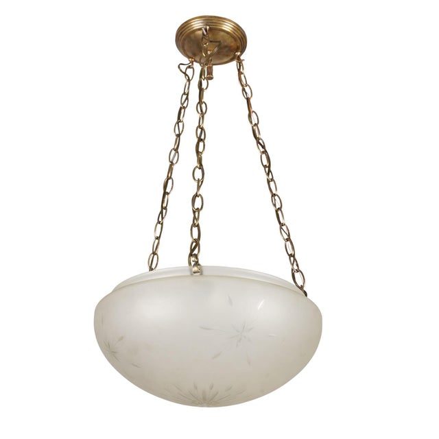 Vintage pendant light made of an etched frosted bowl glass shade, brass finished canopy, and steel chain. This requires...