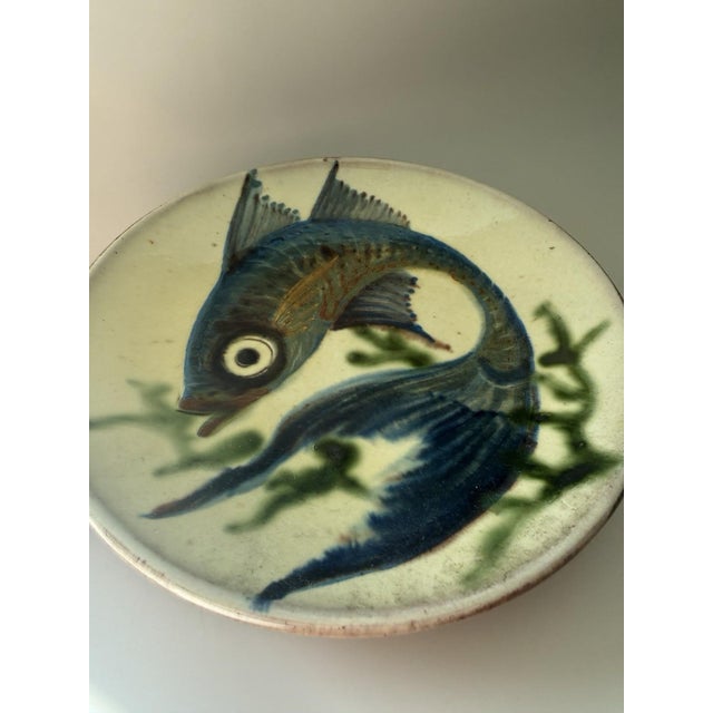 The Vintage Puigdemont Ceramic Wall Plate is a collector's item that adds an elegant touch to any home decor. Made of...