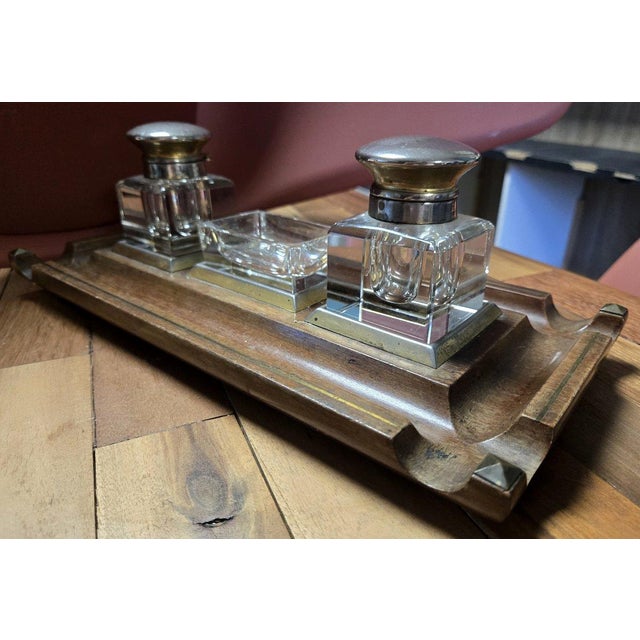 English mahogany inkwell with gilt brass trim, circa 1900 Two glass inkwells with silver-plated metal stoppers H 12 x 38 x...