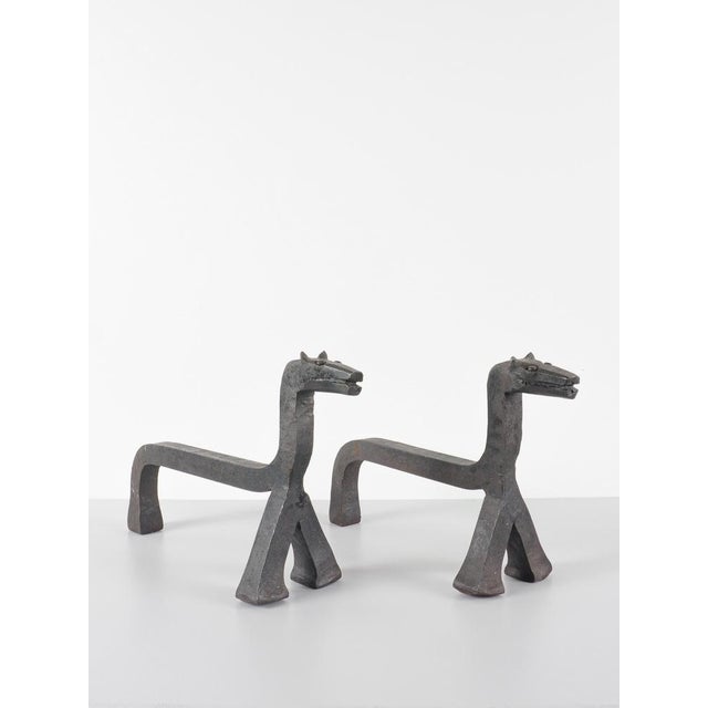 Anonymous pair of andirons france, circa 1960 wrought iron h: 24 cm / w: 12 cm / d: 38 cm excellent overall condition....