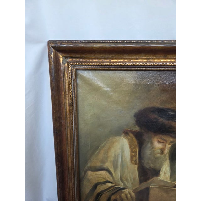his large antique oil painting depicts a dramatic Jewish scholar scene inspired by Dutch Baroque masters, reminiscent of...