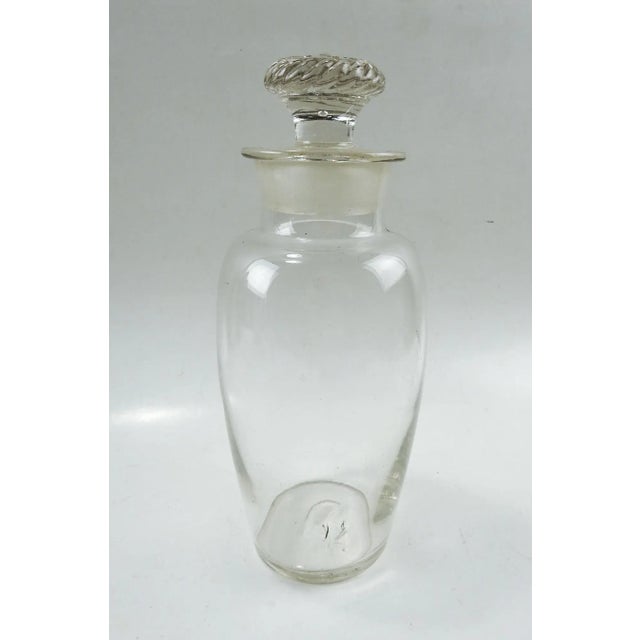 Antique mold blown glass apothecary jar. Top has decoration with company S. D. Ache, Co. Pittsburg embossed on top. Pontil...