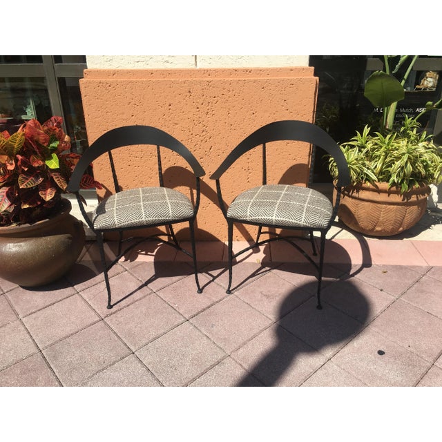 Charleston Forge's "Hudson Wrap" arm chairs feature a hand crafted hammered iron frame, gently curved "x" stretcher and...