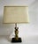 - Table lamp designed in the style of Maison Jansen - Brass horse head is mounted on a wooden base - Features fabric shade...
