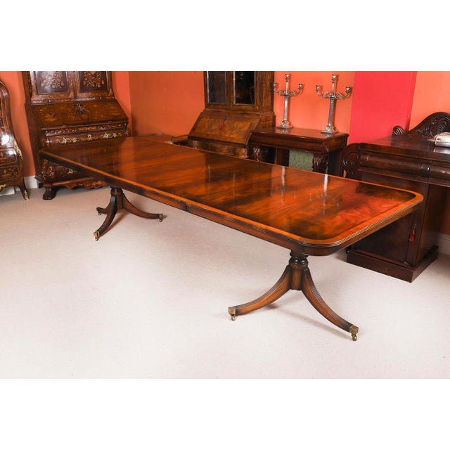 This is a superb Vintage twin pedestal dining table in elegant George III style, crafted in flame mahogany, bought at...