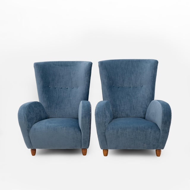 An elegant pair of Italian high-back armchairs, attributed to Paolo Buffa and dating back to the 1950s. The armchairs...