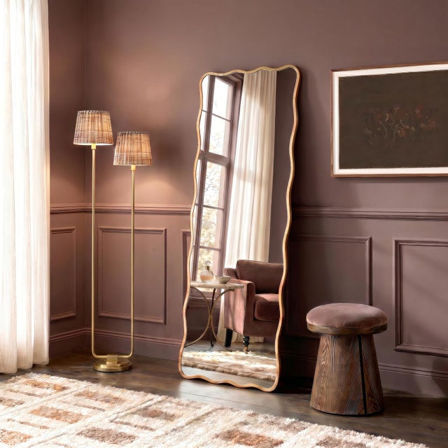 An undulating gilded frame and beveled mirror edge give the Candice Dressing Room Mirror a feminine, glamorous look. Sure...