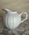 Beautiful white porcelain creamer dish or small pitcher by Paris Royal. Sea urchin pattern with coral patterned handle....
