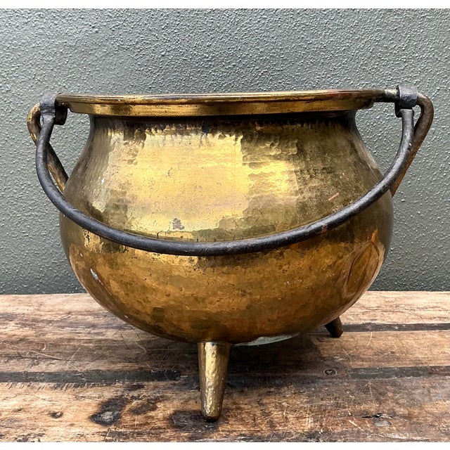 Infuse your home with old-world character with this exceptional vintage hammered brass cauldron. This substantial vessel...