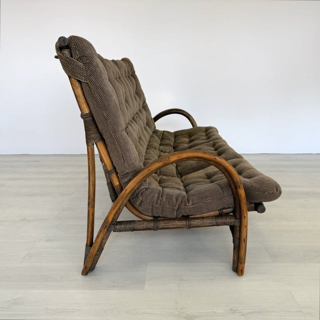 Dimensions: H 37.7” x W 67” x D 37.7” x SH 16” Vintage bamboo and rattan three-seater sofa manner of Rohe Noordwolde....