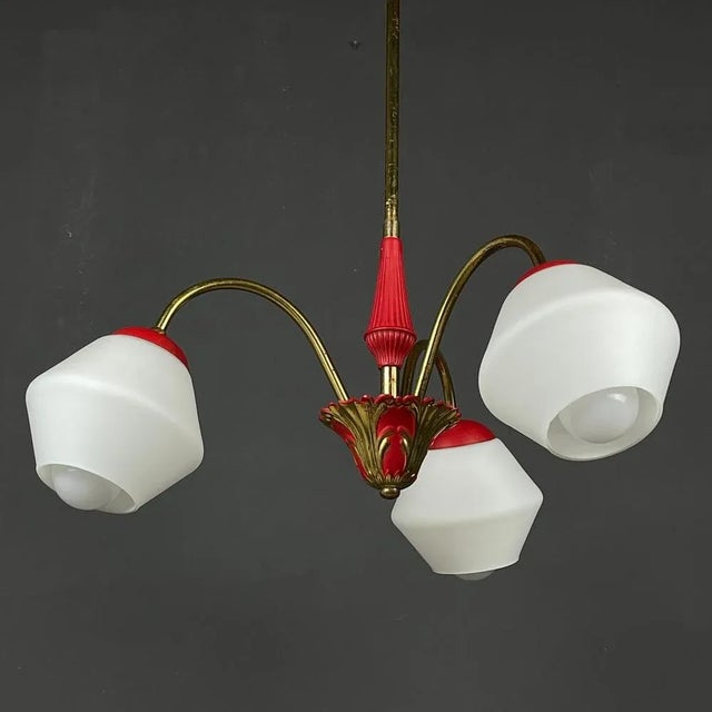 Add a touch of timeless elegance to your space with this stunning vintage 3-arm chandelier. Crafted in Italy during the...