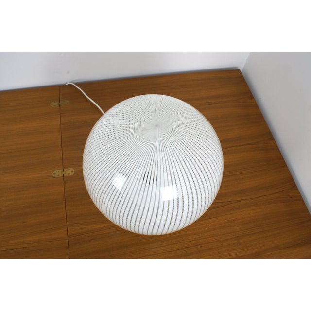 Large table lamp from the 'Tessuto' series, made of hand-blown Murano glass. Designed by Ludovico Diaz de Santillana for...