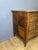 A Louis XVI style commode with a central projection, crafted from solid walnut and walnut veneer, as well as native wood....