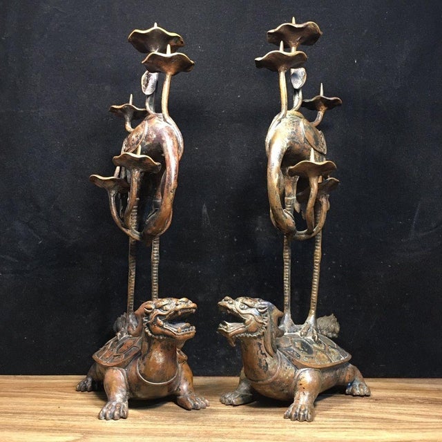 This is an impressive pair of patinated bronze candle holders featuring a fascinating mythological design. Each piece...