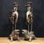 This is an impressive pair of patinated bronze candle holders featuring a fascinating mythological design. Each piece...