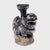Richly aged with wabi-sabi texture, this petite ceramic sculpture is a 19th-century Chinese candle stand molded in the...