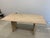 The color from the original site is cerused white. It’s alight oak. Table doesn’t have wear and tear it was barely used.