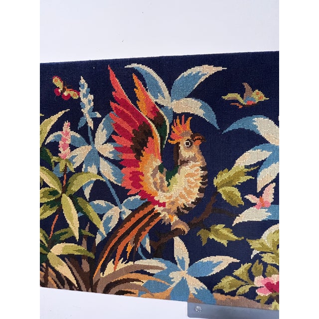 A vibrant and finely detailed textile panel depicting an exotic garden scene, rendered in a rich palette against a deep...