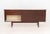 Scandinavian Modern Style Rosewood Sideboard, with white laminate top above two door cabinet with two shelves on the...