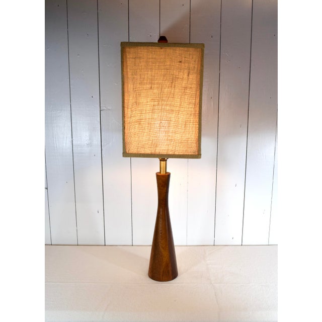 Mid-Century Modern turned wood hourglass table lamp of solid Black Walnut in the manner of Phillip Lloyd Powell, USA, c....