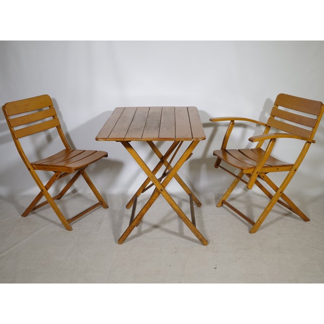 Folding vintage garden furniture set made of solid wood from the 1970s. The 3-piece set consists of a height-adjustable...