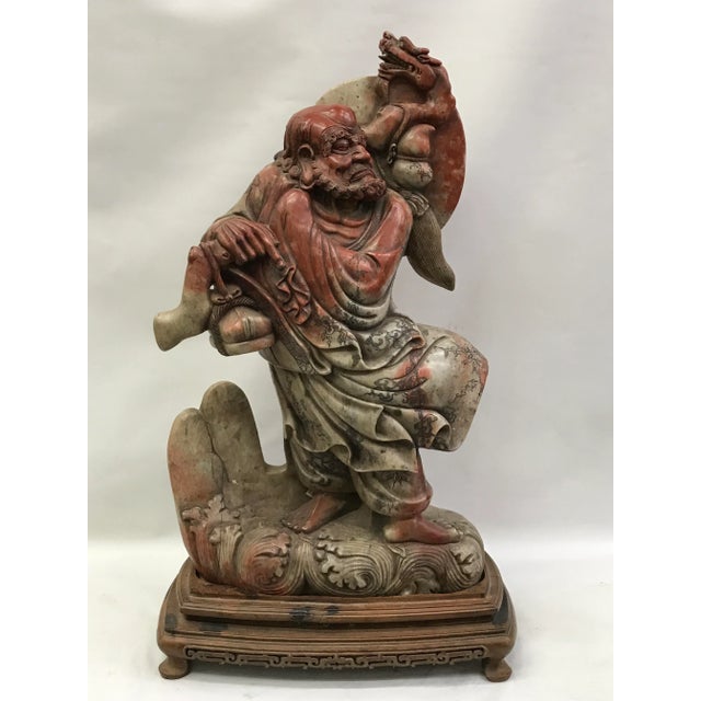 Chinese art carved Soapstone Monk with wood stand. Very detailed carving. Very good and excellent condition.